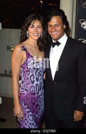 (dpa)  - Actress and top model Elizabeth Hurley and her boyfriend Arun Nayer arrive to the 'Chopard Trophy Awards' show on the sidelines of the film festival in Cannes, France, 14 May 2004. Stock Photo