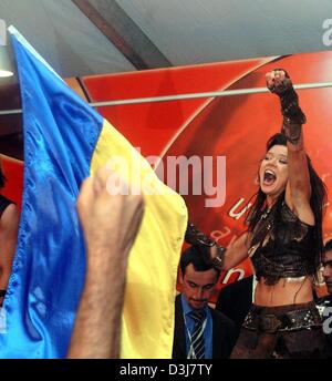 (dpa) - The winner of this year's Eurovision Song Contest, Ruslana from Ukraine, waves the Ukraininan flag on stage in Istanbul, Turkey, 16 May 2004. It was the first time ever that the Ukraine won the Grand Prix song contest. Stock Photo