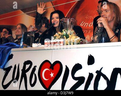 (dpa) - The winner of this year's Eurovision Song Contest, Ruslana from Ukraine (C), and her band smile after winning the Eurovision Song Contest in Istanbul, Turkey, 16 May 2004. It was the first time ever that the Ukraine won the Grand Prix song contest. Stock Photo