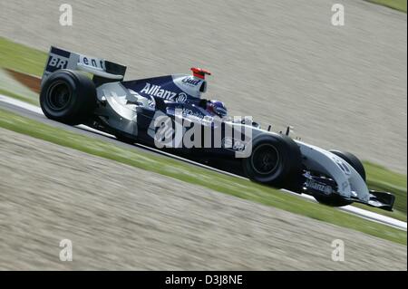 (dpa) - Colombian Formula One pilot Juan Pablo Montoya races during the 2004 San Marino Grand Prix in Imola, Italy, 25 April 2004. Montoya (Team BMW-Williams) finished in third place. Stock Photo