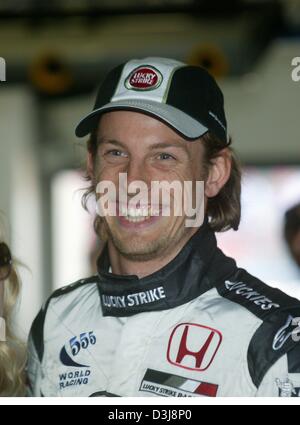 dpa English Formula One Pilot Jenson Button Awaits The Start Of The dpa English Formula One Pilot Jenson Button Awaits The Start Of The