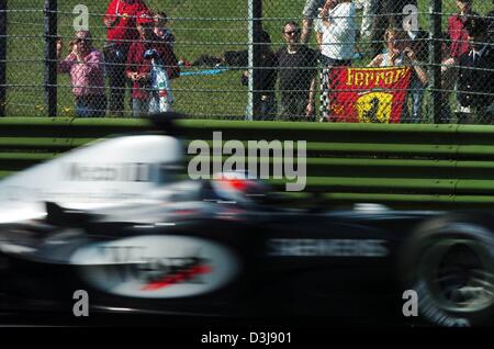 (dpa) - Finnish formula one pilot Kimi Raeikkoenen (McLaren-Mercedes) races in his racing car along the formula one circuit in Imola, Italy, 24 April 2004. Raeikkoenen prepared for the San Marino grand prix which took place on 25 April 2004. Stock Photo