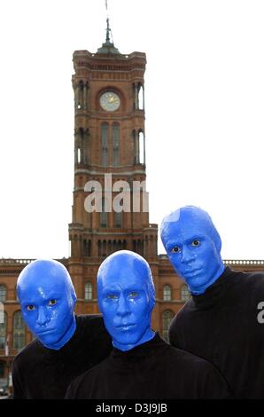 (dpa) - Three members of the Blue Man Group pose in front of the Red City Hall in Berlin, 7 April 2004. The live performance show of the three blue men from the United States will run from 8 May in the German capital. It is their first ever show outside the US. In Germany, the group is best known for their appearance in a commercial for Intel computer chips. Stock Photo