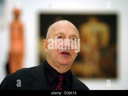 German artist Georg Baselitz stands in front of his artwork at the Bundeskunsthalle (federal art hall) in Bonn, Germany, 31 March 2004. The retrospective which will be held at the art hall from 2 April until 8 August 2004, titled 'Pictures That Turn Your Head', is a comprehensive overview of approximately 130 works of art from all areas of Baselitz' creative production from 1959 to Stock Photo