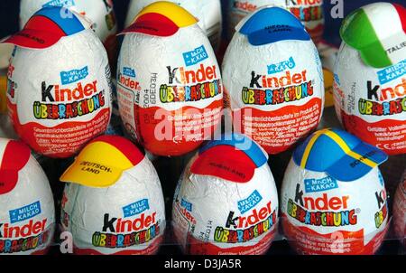 (dpa) - Rows of kinder surprise eggs are decorated with caps displaying different national flags on the occasion of this year's 28th Olympic Games in Potsdam, Germany, 30 March 2004. The egg was invented by Michele Ferrero in 1974 and celebrates its 30th anniversary today. Stock Photo