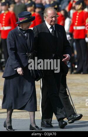 (dpa) - Queen Margrethe II of Denmark (L) and King Juan Carlos of Spain attend the funeral of former Dutch Queen Juliana at the Nieuwe Kerk (New Church) in Delft, Netherlands, 30 March 2004. The former queen died on 20 March 2004 at the age of 94 and was buried in the family crypt in Delft. Crowds of people arrived to witness the event. Stock Photo