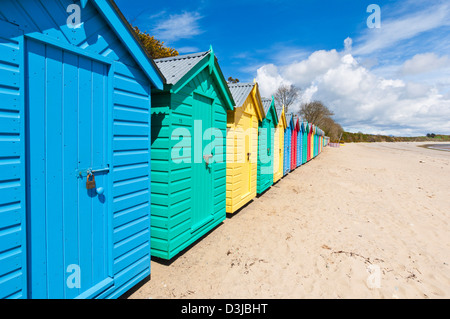 Bright painted beach huts on Llanbedrog beach Llyn peninsula Gwynedd North Wales UK GB EU Europe Stock Photo