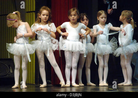 (dpa) - Young female ballet dancers pictured during a dress rehearsal for a ballet evening at the Hegelsberg hall in Griesheim, Germany, 6 March 2005. Ballet teacher Rosita Bastian modified Tschaikowsky's 'Nutcracker' so that it is suitable for children and teenagers. Stock Photo