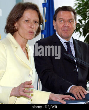 (dpa) - German Chancellor Gerhard Schröder listens to the talk given by former German Presidents wife, Christina Rau in the Chancellery in Berlin, 18 May 2005. Rau presented the preliminary results on the tsunami relief initiative for southeast Asian countries before the cabinett. Stock Photo