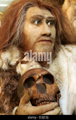 (dpa) - The replication of a neanderthal pictured at the Helms Museum in Hamburg, Germany, Friday, 27 May 2005. The archeaological exhibition 'Neanderthals in Europe, which runs until December 2005, features two dozen of lifelike replica of neanderthals by the Belgian artist Dirk Claesen. The neanderthal exhibitis are presentend in their typical lifelike situations and visitors are Stock Photo