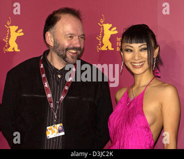 (dpa) - Chinese actress Bai Ling and Ukrainian novelist Andrei Kurkov smile as they poses together during a press conference in Berlin, 10 February 2005. The members of international jury of this year's Berlinale filmfestival were introduced to the press today. The jury has to watch a total 22 films which have been entered into the competition. Stock Photo