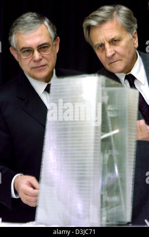 (dpa) - The French President of the European Central Bank (ECB), Jean-Claude Trichet (R) and his Greek Vice President Lucas Papademos examine a model of the new ECB headquarters in Frankfurt, Germany on Thursday 20 January 2005. The building was designed by Coop Himmelb(l)au, an Austrian team of architects and resembles two office towers  twisting and engulfing each other on the em Stock Photo