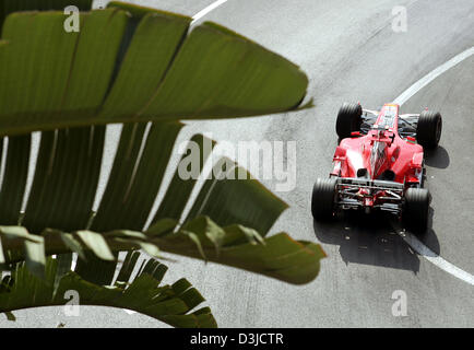 (dpa) - German Formula One driver Michael Schumacher of Ferrari steers his racecar during the Monaco Grand Prix training session in Monte Carlo, Monaco, Saturday 21 May 2005. Stock Photo