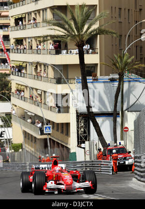 (dpa) - German Formula One driver Michael Schumacher of Ferrari steers his racecar during the Monaco Grand Prix training session in Monte Carlo, Monaco, Saturday 21 May 2005. Stock Photo