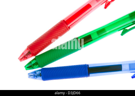 Red, green and blue ballpoint pens on white background Stock Photo