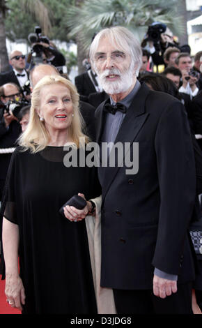 (dpa) - Austrian film director Michael Haneke (R) arrives with his wife at the 58th International Film Festival in Cannes, France, 11 May 2005. Stock Photo