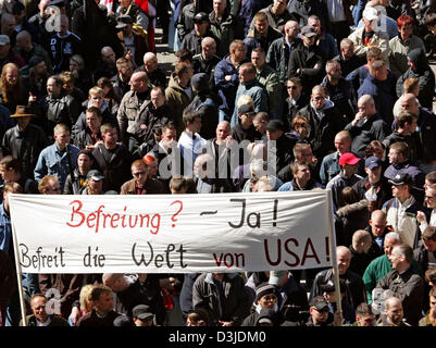 (dpa) - Members of the German right-wing extremist party NPD gather for a rally on Alexanderplatz square in Berlin, 08 May 2005. The banner reads 'Liberation? - yes!, Liberate the world from the USA'. According to the police, around 3,000 people participated in the rally. Stock Photo