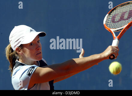 (dpa) - Belgian tennis pro Justine Henin-Hardenne powerfully returns the ball of adversary Russian Nadia Petrova in the Qatar Total German Open final match in Berlin, Germany, 8 May 2005. Henin-Hardenne won the final 6-3, 4-6 and 6-3. Stock Photo