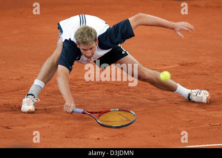 (dpa) - German tennis pro Florian Mayer struggles during his first round match against Croatian Mario Ancic at the Tennis Masters in Hamburg, Germany, 9 May 2005. Mayer lost the match 1-6 and 2-6. Stock Photo