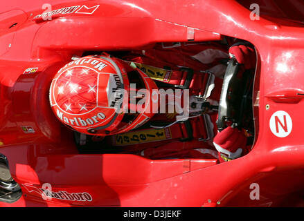 (dpa) - German Formula One driver Michael Schumacher of Ferrari drives his racing car on the Formula One racetrack in Imola, Italy, Friday 22 April 2005. The Grand Prix of San Marino will start here Sunday 24 April 2005. Stock Photo