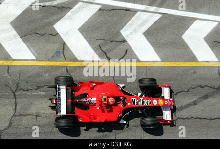 (dpa) - German Formula One driver Michael Schumacher of Ferrari drives his racing car on the Formula One racetrack in Imola, Italy, Friday 22 April 2005. The Grand Prix of San Marino will start here Sunday 24 April 2005. Stock Photo