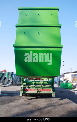 Large green commercial garbage bin with one side lid eft open Stock Photo -  Alamy