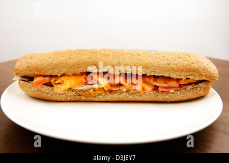 Cheese Ham Bacon Melt in a brown bread baguette Stock Photo