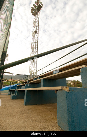 bleachers grandstand grandstands seat seats seating at sporting event events live spectators spectator viewing area crude rundow Stock Photo