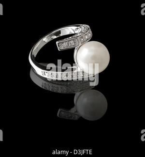 Ring with pearl and diamonds on black background Stock Photo