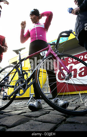 (dpa) - German cyclist Erik Zabel of team T-Mobile stands with his bike at the start of the traditional Paris-Roubaix race in Compiegne, France, 10 April 2005. About 55 kilometres of the famous 259 kilometre long race take the riders over the infamous cobblestone roads of northern France. Stock Photo