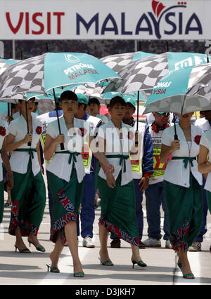 (dpa) - Grid Girls line up before the Malaysian Grand Prix in Sepang, near Kuala Lumpur, Malaysia, 20 March 2005. Stock Photo