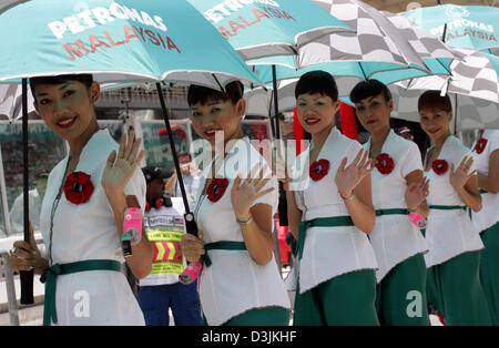 (dpa) - Grid Girls line up before the Malaysian Grand Prix in Sepang, near Kuala Lumpur, Malaysia, 20 March 2005. Stock Photo