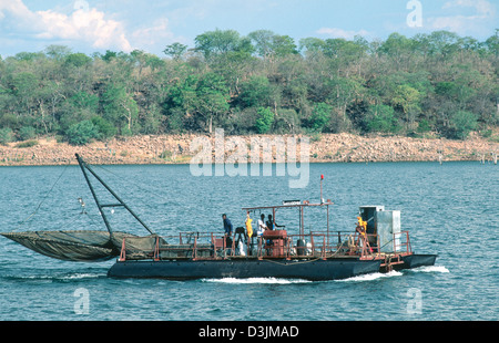 Fishermen on a night-time fishing boat returning to base with their catch of Kapenta. Lake Kariba. Zimbabwe Stock Photo