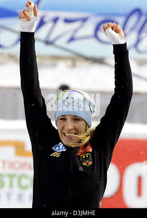 (dpa) - German speed skater Anni Friesinger celebrates after finishing in second place in the Women's 1000 meter race at the Speed Skating World Championship in Inzell, Germany, 6 March 2005. Stock Photo