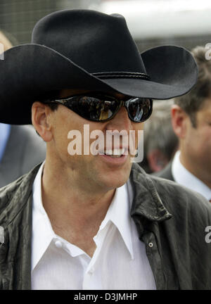 (dpa) - US-born actor Nicolas Cage on the starting grid before the Grand Prix of Australia, Sunday 06 March 2005 in Melbourne, Australia. Giancarlo Fisichella of Italy won in front of Rubens Barrichello of Brazil and Fernando Alonso of Spain. Stock Photo