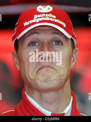 (dpa) - German Formula One driver Michael Schumacher (Ferrari) grimaces at the Grand Prix circuit in Albert Park, Melbourne, Australia, 05 March 2005. Stock Photo