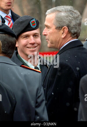 (dpa) - US President George W. Bush (R) greets Bundeswehr soldiers who were deployed to Afghanistan at the electoral castle in Mainz, Germany, 23 February 2005. Bush is on a one-day official visit to Germany. Stock Photo