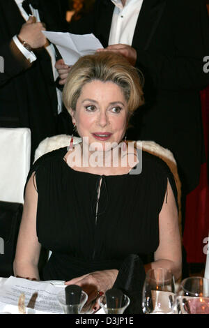 (dpa) - French actress Catherine Deneuve pictured during the 'Cinema for Peace' gala at the concert house in Berlin, Germany, 14 February 2005. The charity event was one of the highlights of this year's 55th Berlinale international film festival. Proceeds go to UNICEF's 'Children Victims of Tsunami in Indonesia' fund. Stock Photo