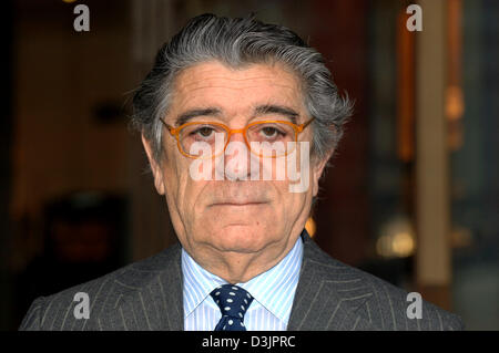 (dpa) - Ciro Paone, owner and founder of Italian fashion company Kiton, presents clothes of the 2005/2006 autumn winter collection prior to a press conference on the occasion of the cpd woman man kidz (collections premieres Duesseldorf) in front of a hotel in Duesseldorf, Germany, 31 January 2005. The latest clothes by 1,500 exhibitors from 51 countries can be seen on the fair grou Stock Photo