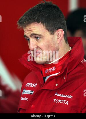 (dpa) - German formula one pilot Ralf Schumacher, the new Toyota pilot, looks contemplative during the test drive of his new racing car in Valencia, Spain, 1 February 2005. Schumacher left BMW Williams and joined Toyota at the end of the last formula one season in 2004. Stock Photo