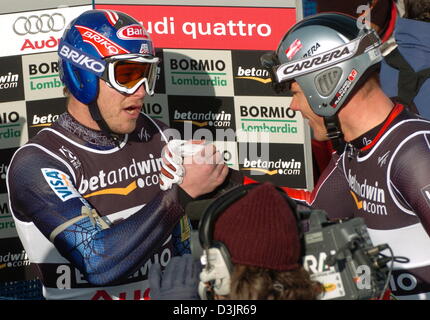 (dpa) - US skier Bode Miller (L) receives congratulations from Austrian Michael Walchhofer (R) after Miller won the Men's Super G at the Alpine Skiing World Championships in Bormio, Italy, 29 January 2005. Walchhofer finished second in front of his teammate Benjamin Raich. Stock Photo