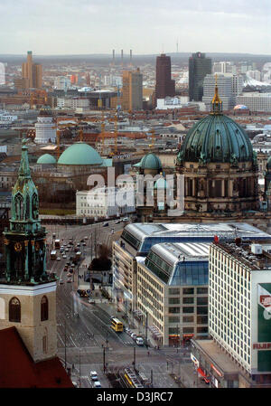 (dpa) - View of Berlin-Mitte (berlin centre) on 21 January 2005. In the foreground can be seen the towers of the St. Marienkirche (Saint Mary's Church). In the photo's centre on the right side is the Berlin cathedral and behind it are three skyscrapers at the Potsdamer Platz (potsdam place). Stock Photo