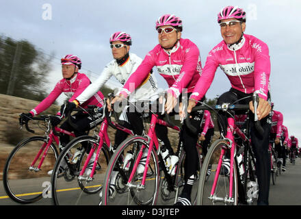 (dpa) - German cycling pros (from R) Erik Zabel, Jan Ullrich, Andreas Kloeden and their teammate Alexandre Vinokourov from Kazakhstan of Team T-Mobile ride their bicycles during a training tour on the Balearic Island of Majorca, near Santanyi, Spain, on Tuesday 11 January 2005. The team prepares for the upcoming cycling season. Stock Photo