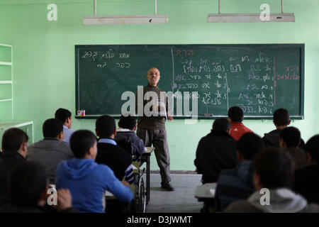 Feb. 20, 2013 - Gaza City, Gaza Strip, Palestinian Territory - A Palestinian teacher teaches Hebrew to ninth grade students at a Gaza school in Gaza City Feb. 20, 2013. Hamas, which controls the Gaza Strip began this year to teach Hebrew to school students from the ninth grade  (Credit Image: © Ashraf Amra/APA Images/ZUMAPRESS.com) Stock Photo