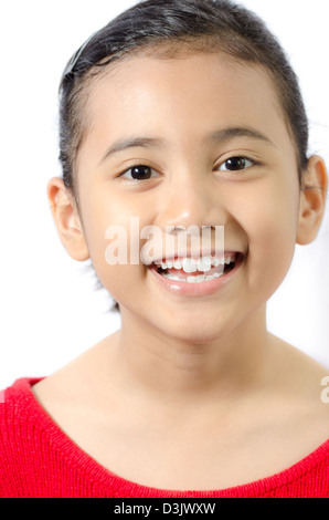 smiling little asian girl wearing red knitted sweatshirt on isolated white background Stock Photo