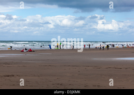 Busy surfing and kayaking beach at Black Rock Sands, Widemouth Bay, nr Bude, Cornwall Stock Photo