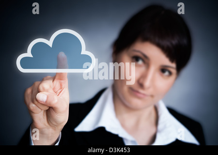 Cloud computing concept. Woman hand click on cloud icon Stock Photo