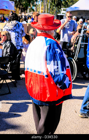 Senior female at the Cortez Fish Festival wearing a colorful patriotic jacket Stock Photo