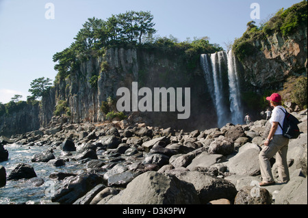Republic of Korea, Jeju Island, Jeongbang Falls, falling from a 23 metre coastal cliff. Stock Photo