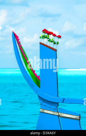 View from the bow of Maldivian wooden dhoni boat on tropical island and turquoise ocean Stock Photo